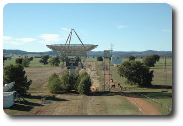 Two dishes in front, heading off to low hills in background