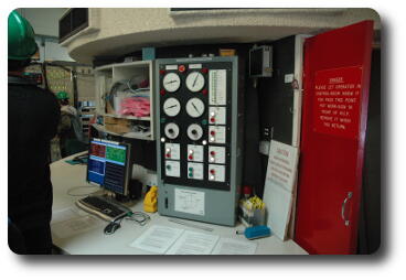 Middle of circular room with telescope control equipment