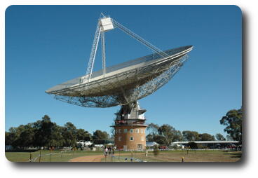 Telescope pointing up, with with box at top of tripod on top of dish
