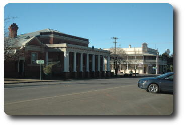 Brick building with white columns across the front