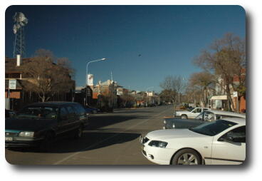 Small town street scene, with back to curb parking