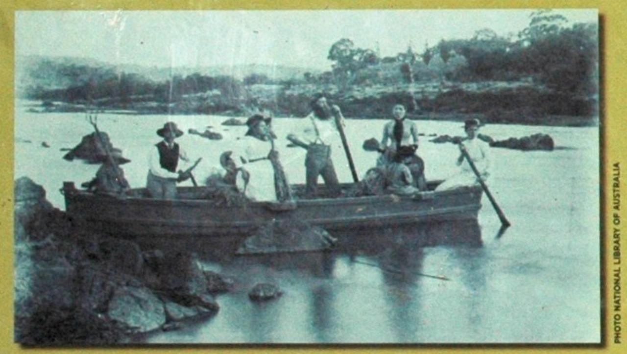 Photo of 8 people crossing river in boat