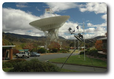 Another tracking dish pointing up, with sculpture of Voyager 2 in foreground