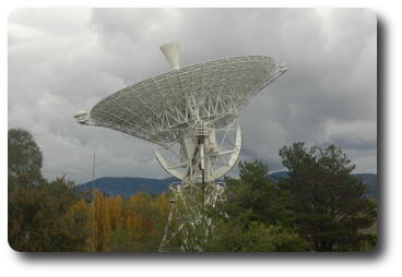 Side on view of first large tracking dish; autumn foliage in background