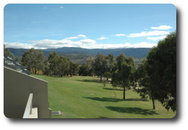 Green lawns, and vista to distant mountains