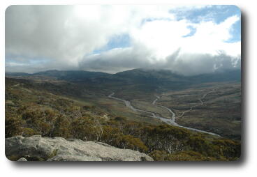 Mountains, cloud covered tops, including Mt. Kosciuszko and Snowy River in foreground