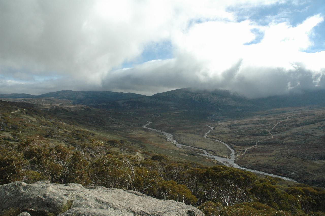 Mountains, cloud covered tops, including Mt. Kosciuszko and Snowy River in foreground