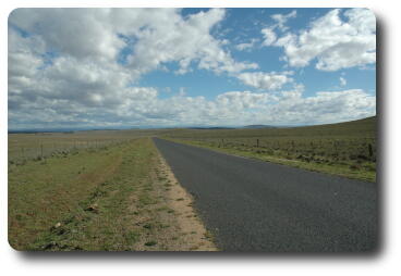 Flat country to barely visible distant mountains