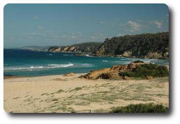 Beach scene, waves and headlands along coast