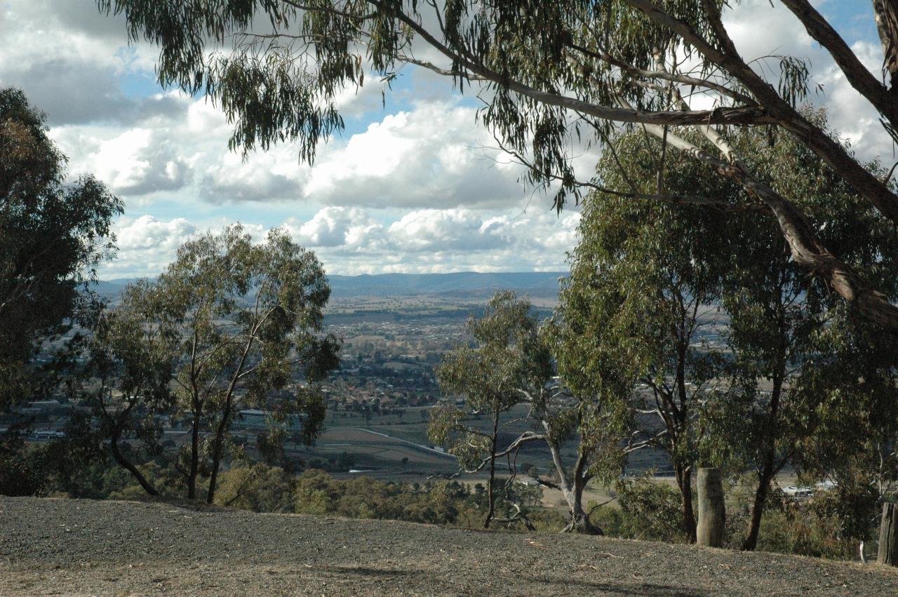 View over city and plains to distant hills