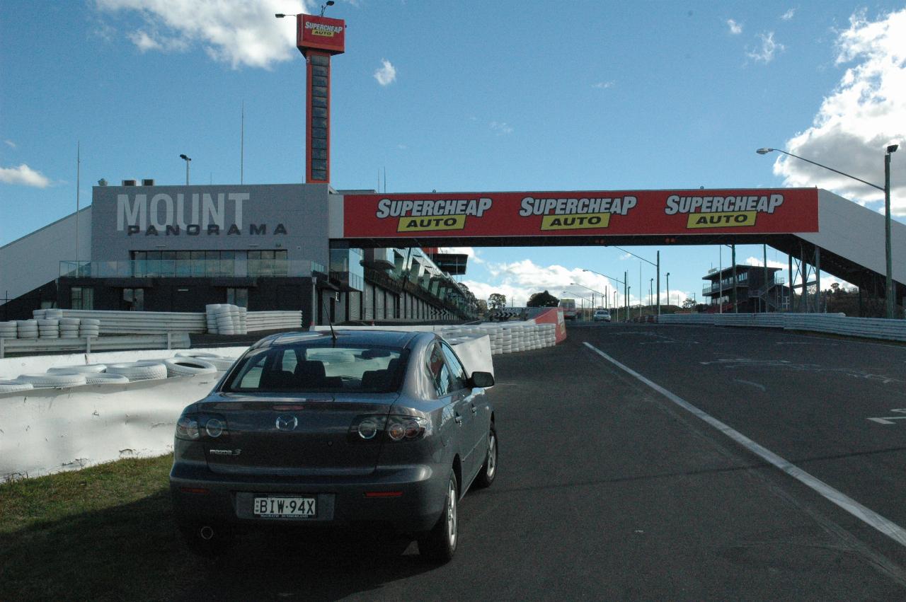 Mazda 3 parked just before the pits on race track