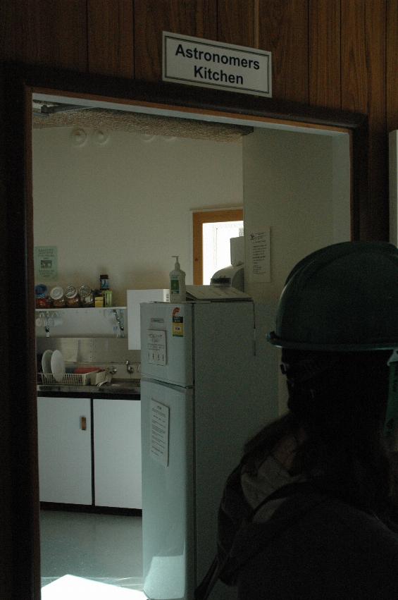 Photo through door into a kitchen