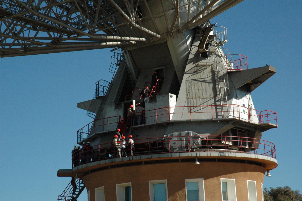 Close up view of telescope base with tour group