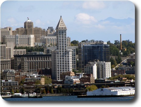 Smith Tower, a white tiled building with narrower upper section