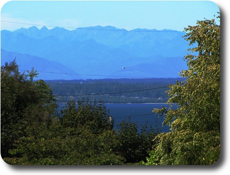 Alki looking to distant Olympic Mountains across Puget Sound