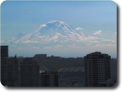 Mt. Rainier somewhat visible over downtown Seattle
