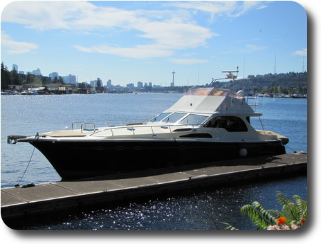 Power boat and view to Space Needle across Lake Union