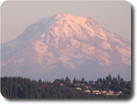 Close up of mountain, bathed in pink of afternoon sunlight