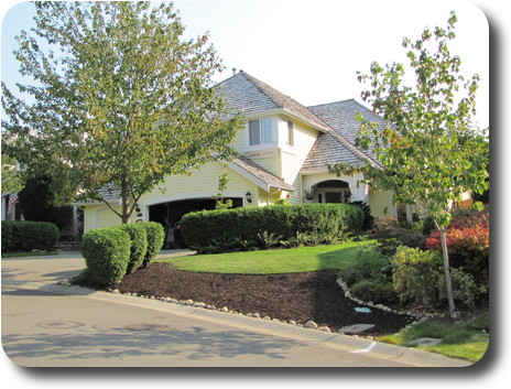 Two storey house, painted light yellow