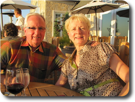 Couple sitting at table on patio
