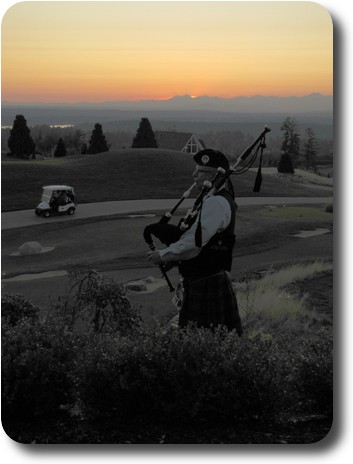 Piper, just visible in foreground, against orange sky over distant mountains