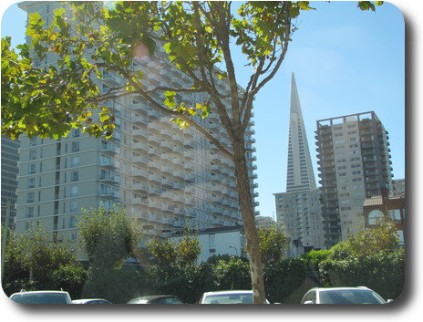 Pyramid shaped building between two others
