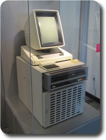 Small file cabinet sized hardware with keyboard, monitor, mouse on top