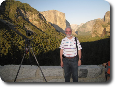 Another photographer standing next to camera on tripod