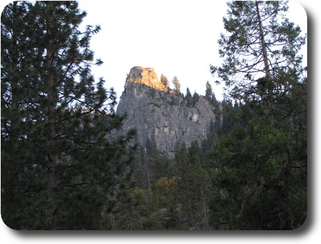 Tip of rocky peak in sunlight, rest in shadow
