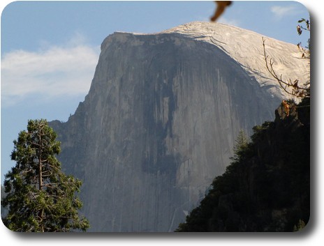Large domed rock with a flat face facing camera