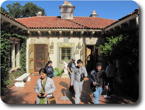 Tourists leaving the building via a three sided courtyard