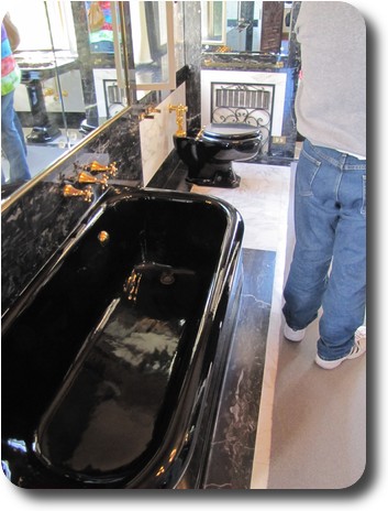 Black bath and toilet, mirrors etc.