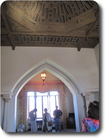 Complex wooden ceiling, with an arched passage to the next room