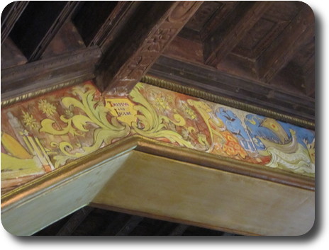 Detailed image of ceiling, showng a shield with Tristan and Isolde on it
