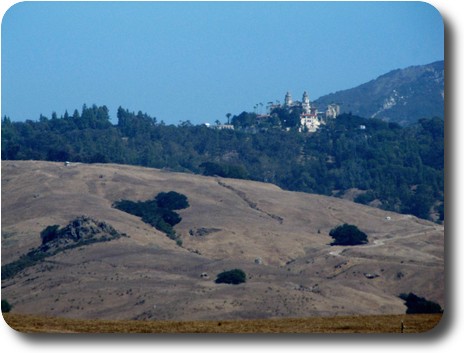 Hearst Castle atop a distant hill, only partly visible