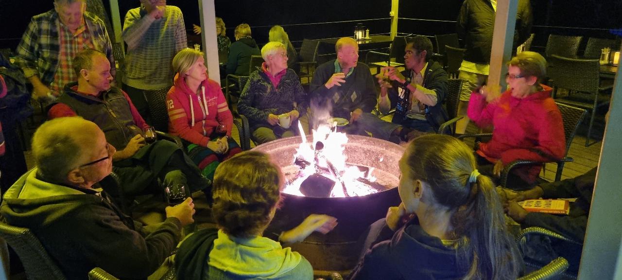 SJR21.d11: around fire after dinner at Savannah Lodge