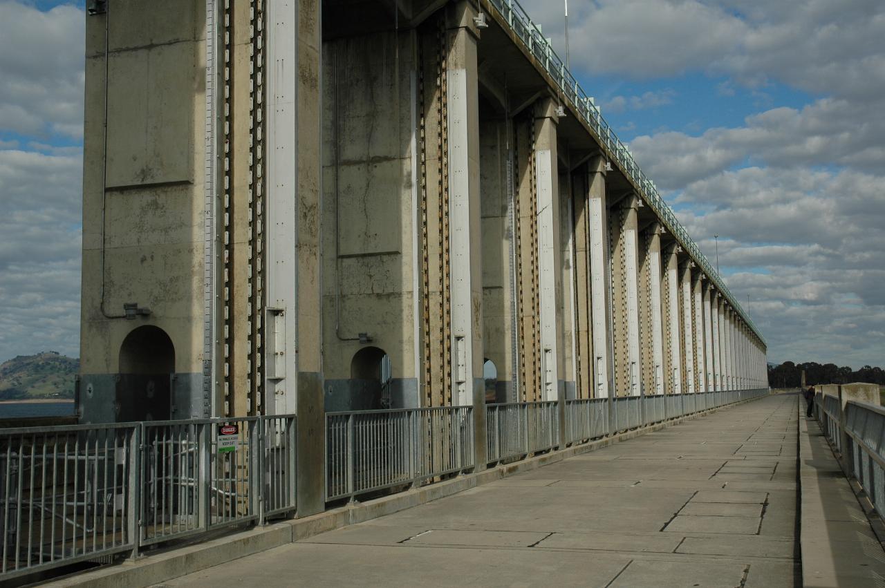 Top of dam wall with concrete towers with walkway on top of them