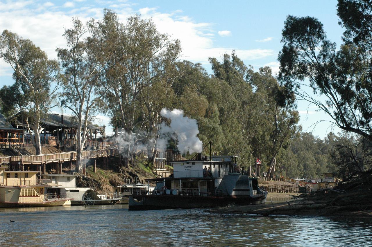 Turned around, paddle wheeler is heading down stream with tourists
