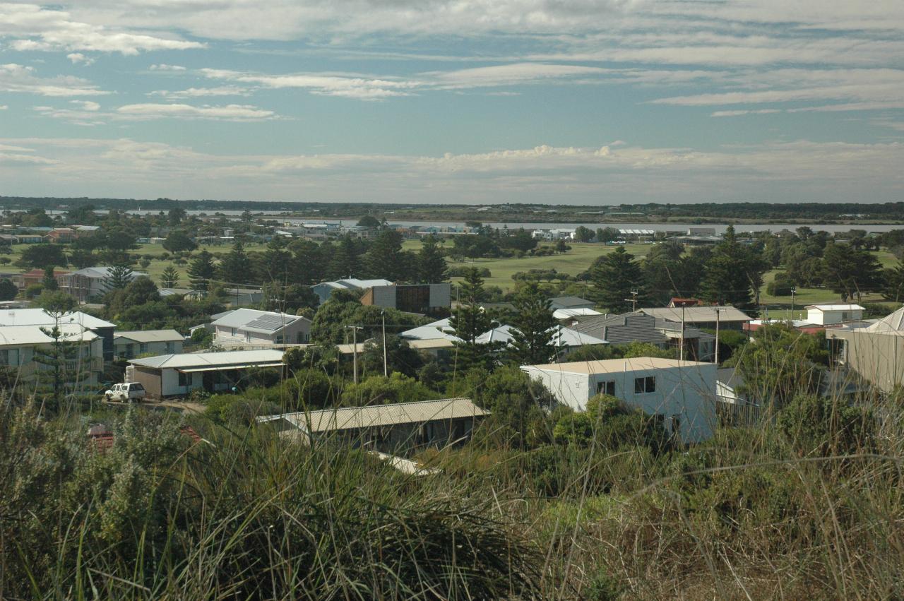 Looking over homes to river and island in the river bend