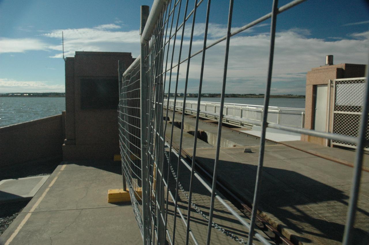 Metal mesh fence blocking access to the barrage walkway