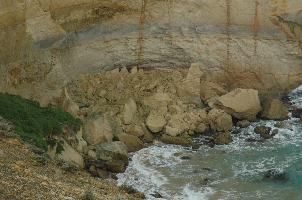 Pile of rocks at the side of the headland after ersion by the sea