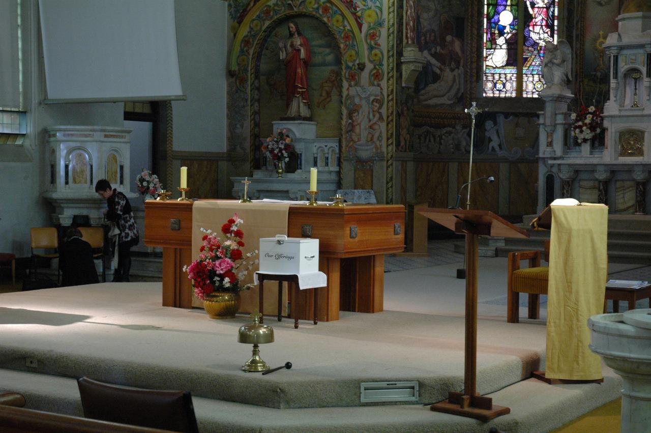 Wooden altar and flowers on raised platform