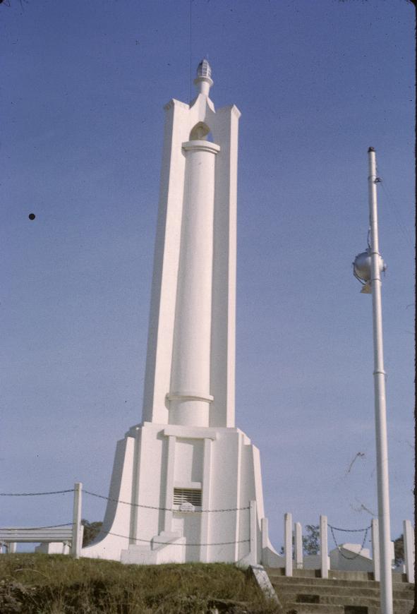 White tower with a cross section of a cross