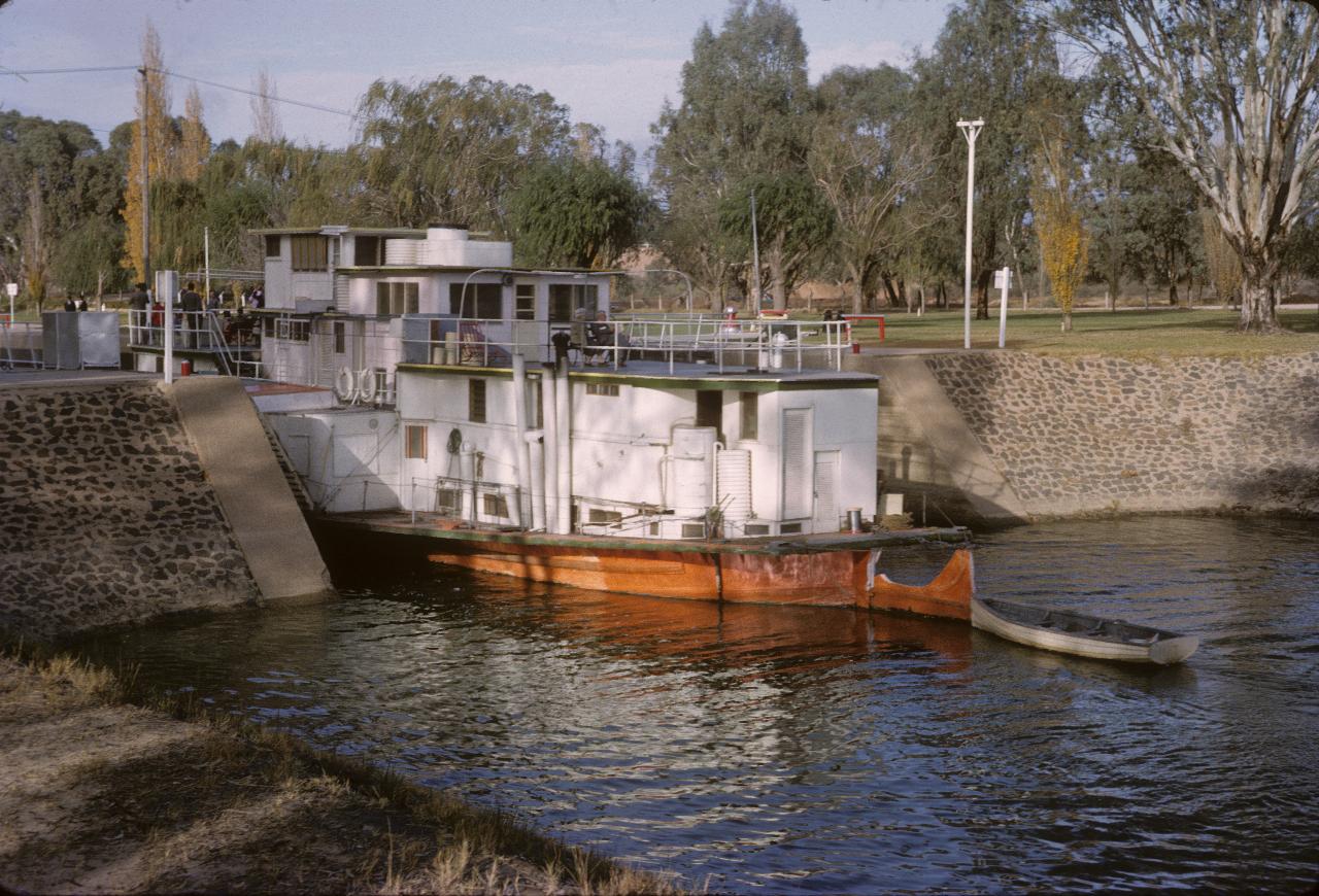 Paddle wheeler half way into the lock on downstream side