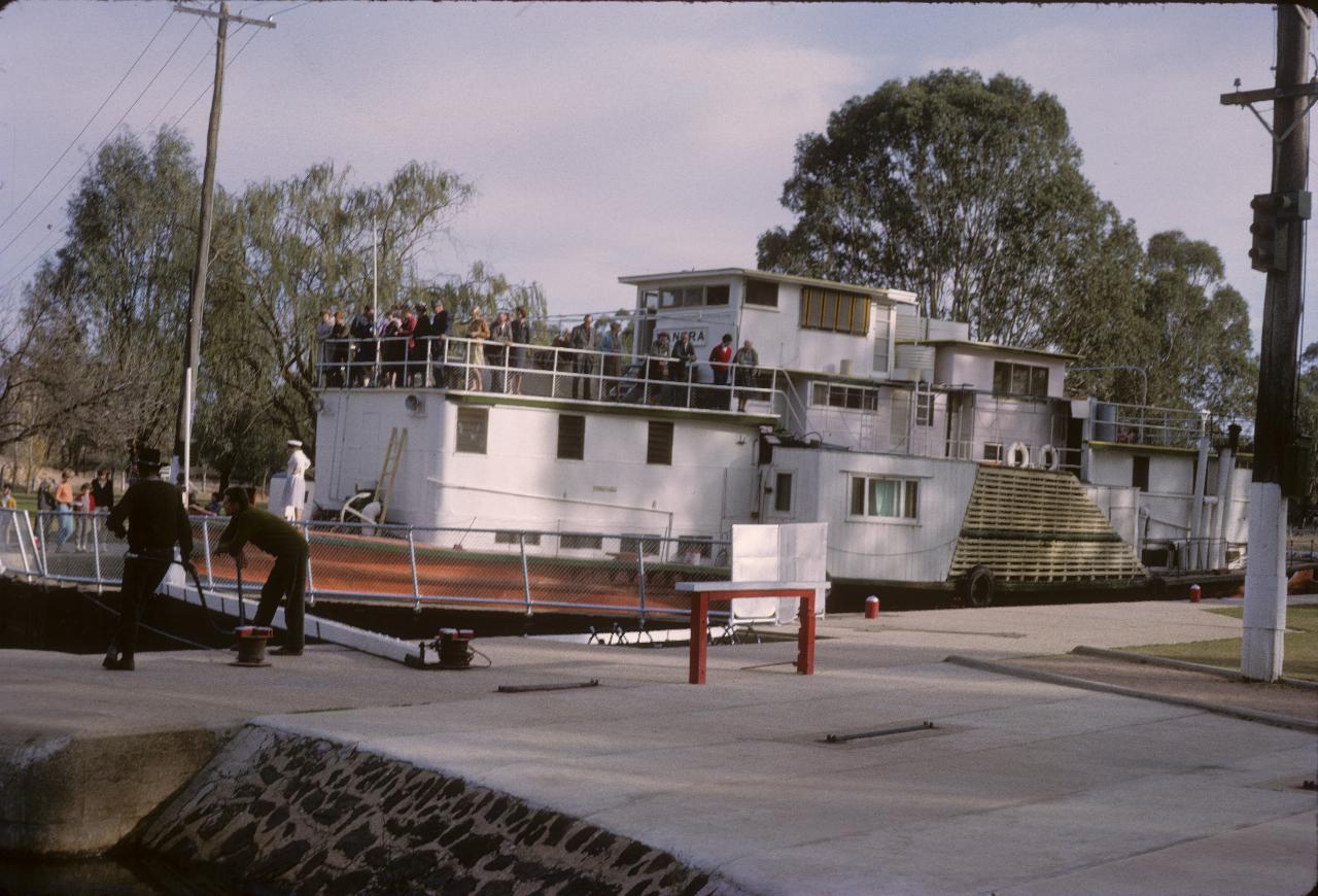 Paddle wheeler is rising in the lock with incoming water