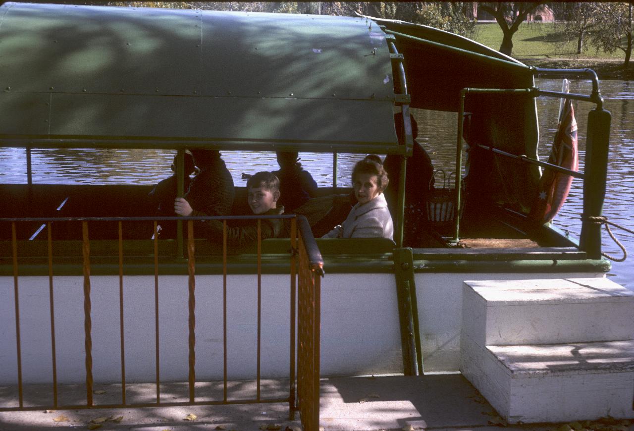 Mother and son in boat at the dock