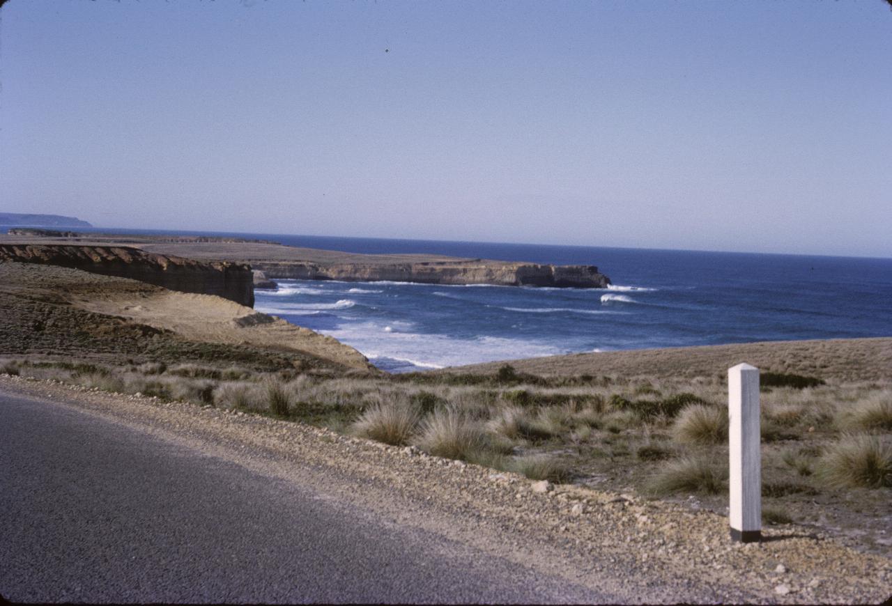 Coastal scene with limestone cliffs, inlets and waves