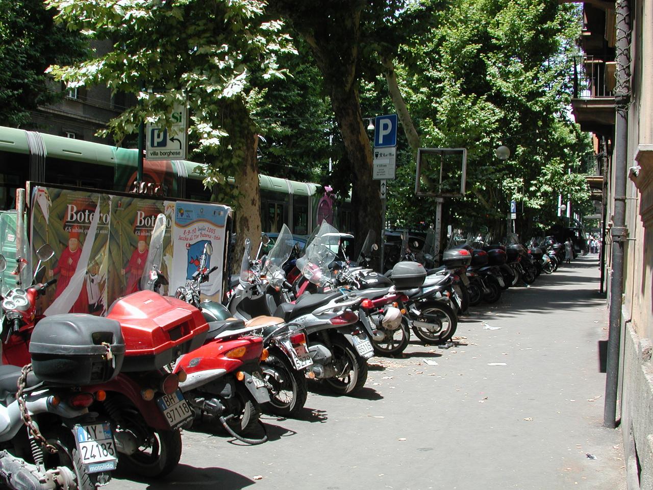 Bike parking along a major Rome street, probably Viale Regina