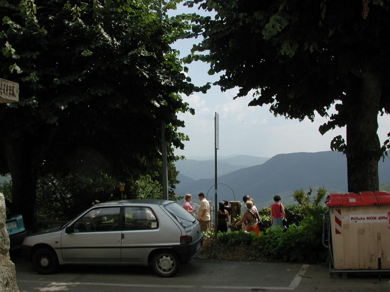 Tour group overlooking hills of Tuscany