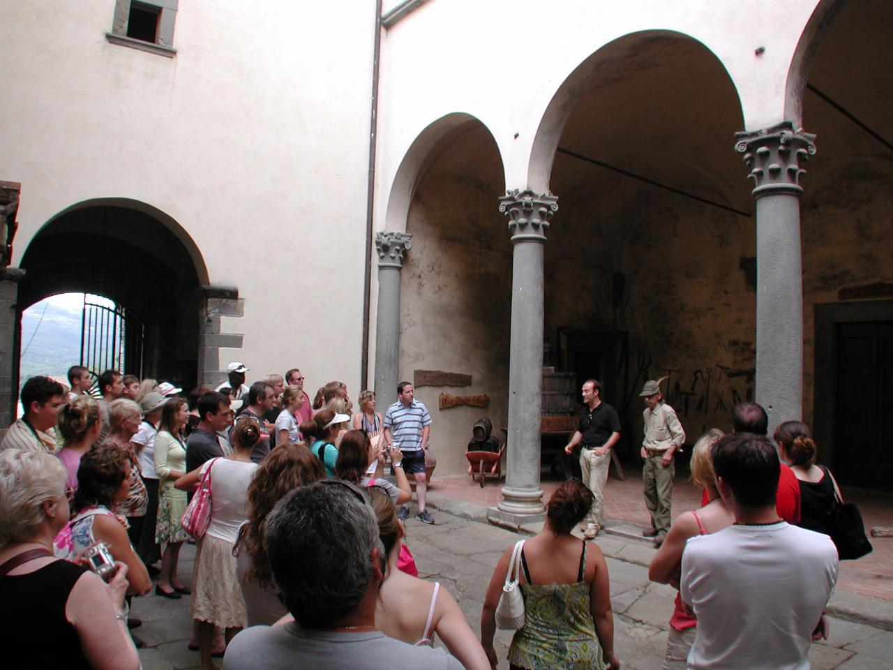 In the castle courtyard, with castle guide and old groundskeeper